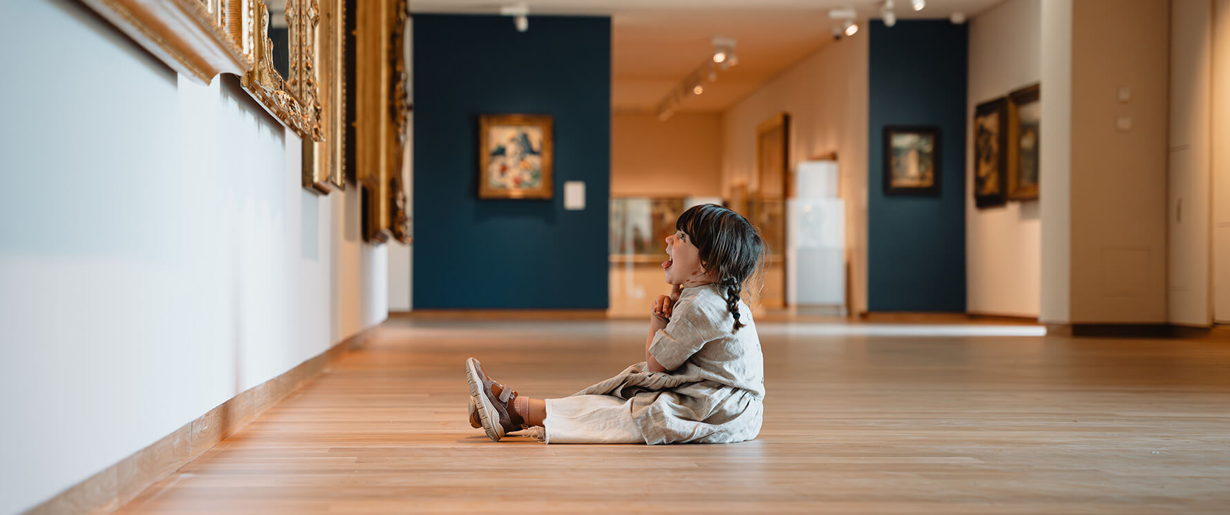 Child in front of art at National Gallery of Scotland